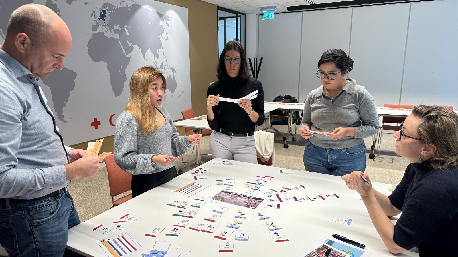 The Climate Centre team tests the new game on locally led adaptation at head office in The Hague. (Climate Centre)